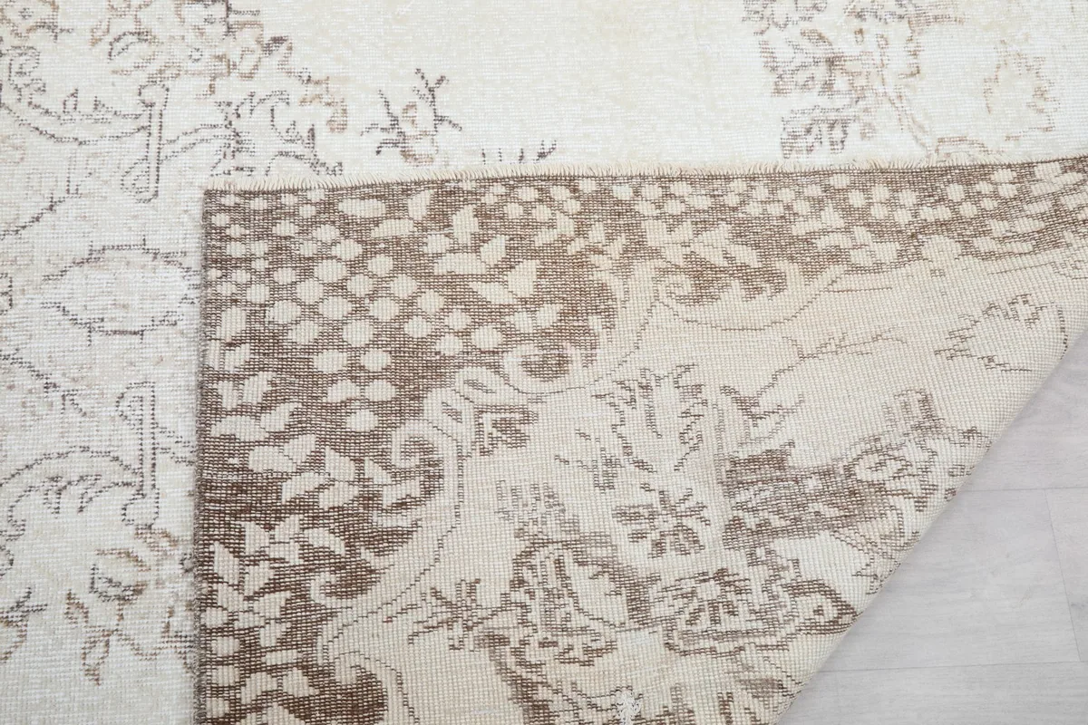 Close-up of the rug's reverse side, revealing the knotting and foundation
