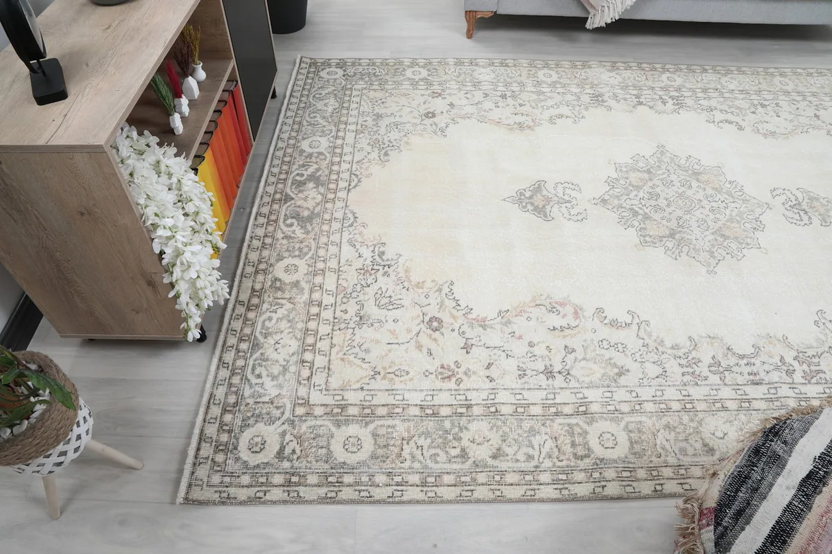 Rug placed in a room, showing its full length from an elevated angle
