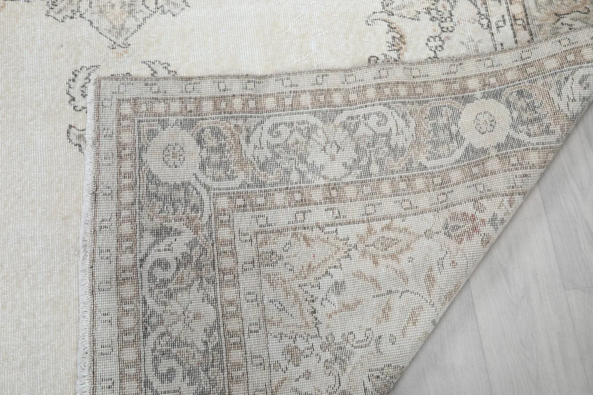 Close-up of the rug's back, revealing the hand-knotted construction