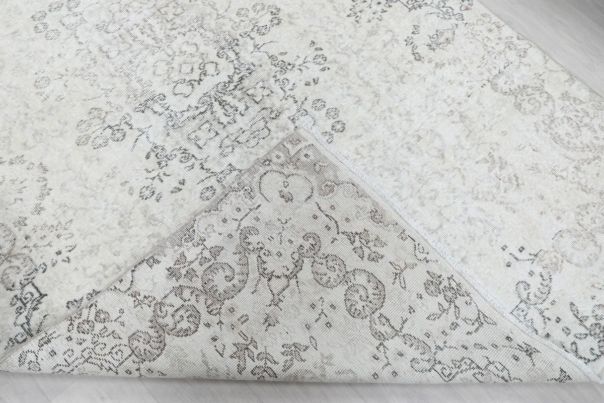 View of the rug's back, revealing the hand-knotted cotton foundation