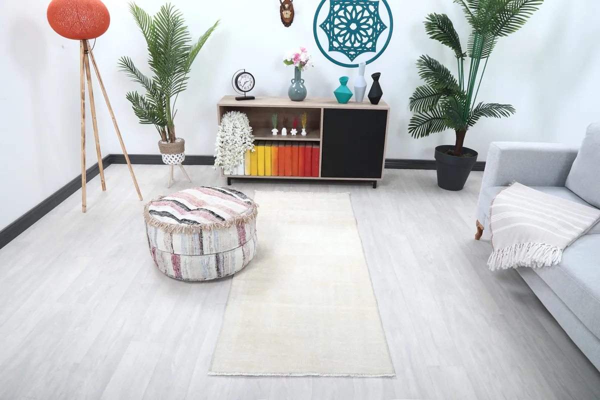 Beige Minimalist Vintage Runner in a modern living space, showcasing its size and light beige color on a light floor.