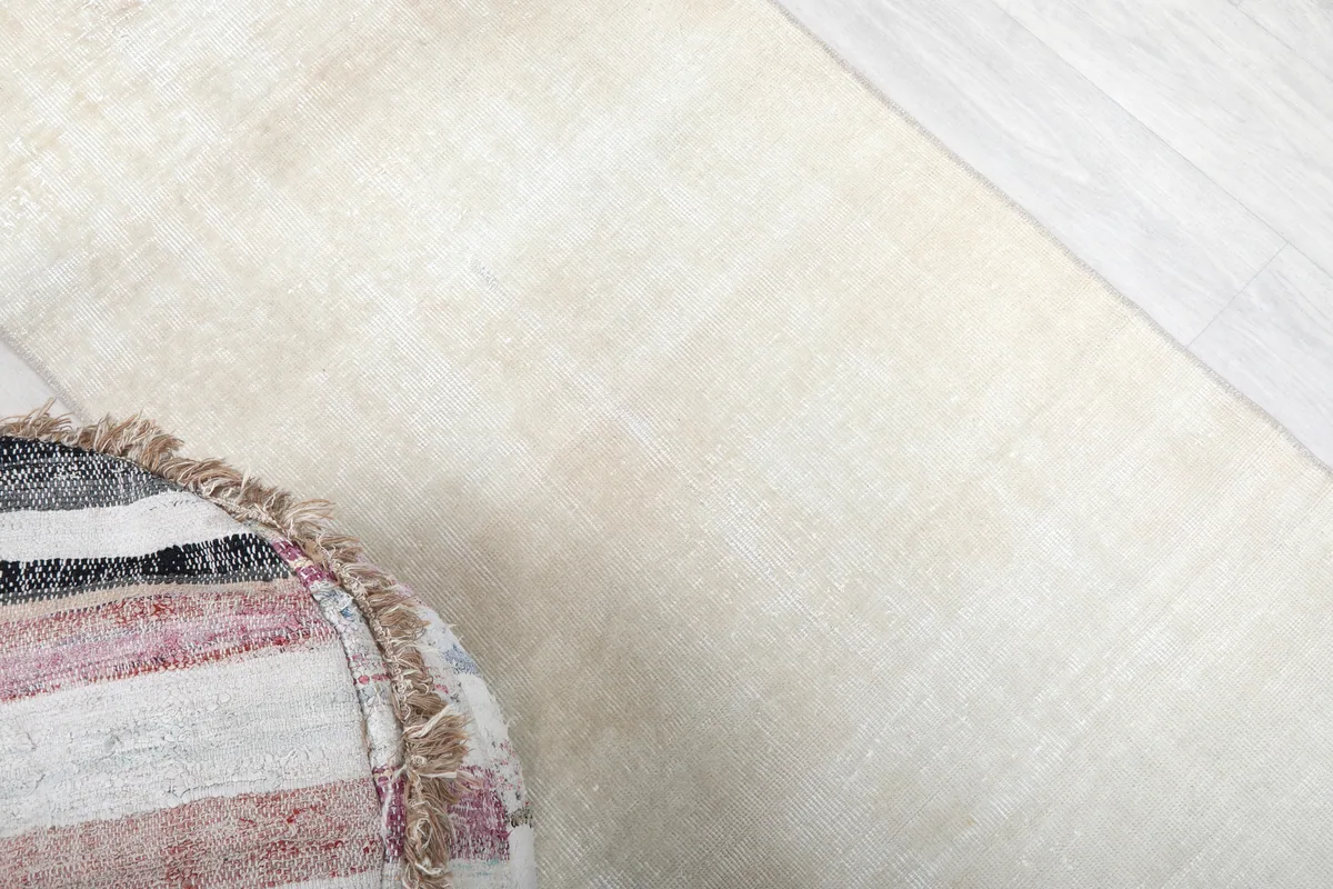 Angled close-up of the Beige Minimalist Vintage Runner, revealing the low pile and natural fiber texture.
