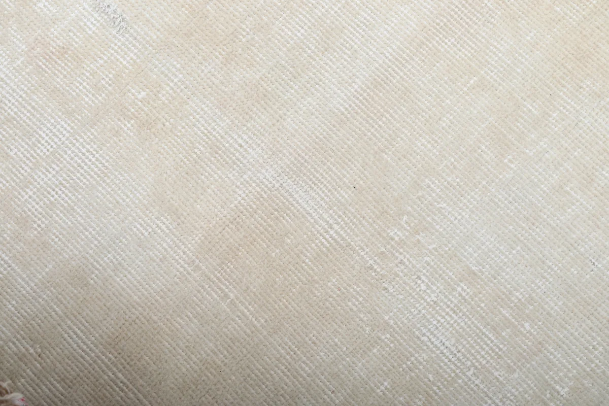 Close-up of the Beige Minimalist Vintage Runner's wool pile, showing the tight knots and subtle sheen.