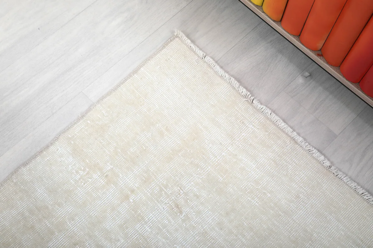 Corner detail of the Beige Minimalist Vintage Runner, showing the subtle finishing of the edges.