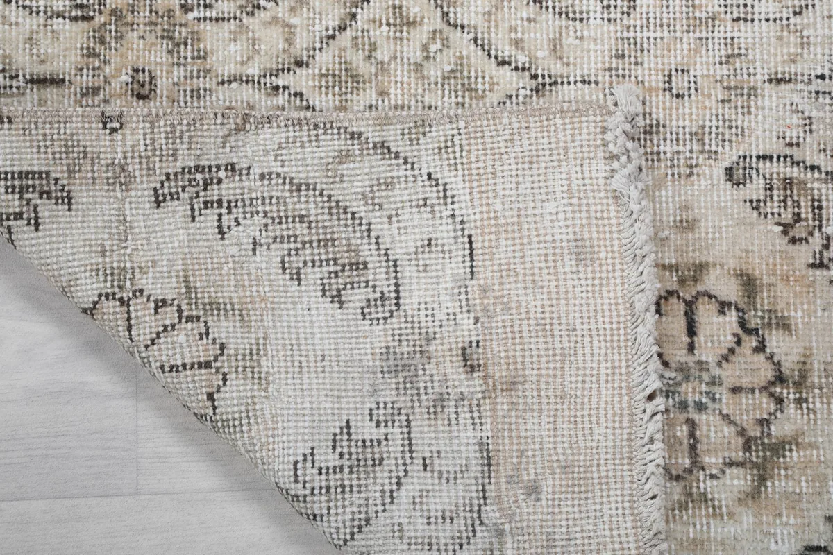Close-up of the rug's underside, showing the consistent knotting and material