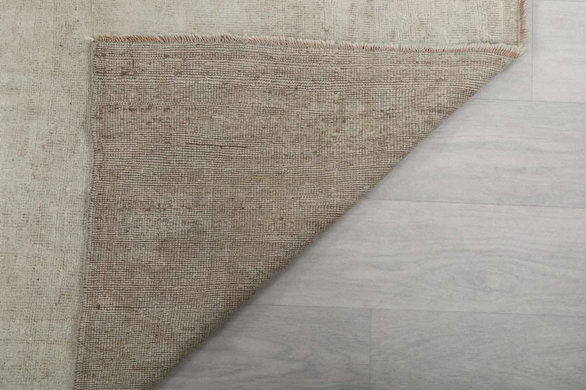 Another view of the rug's underside, revealing the sturdy cotton foundation.