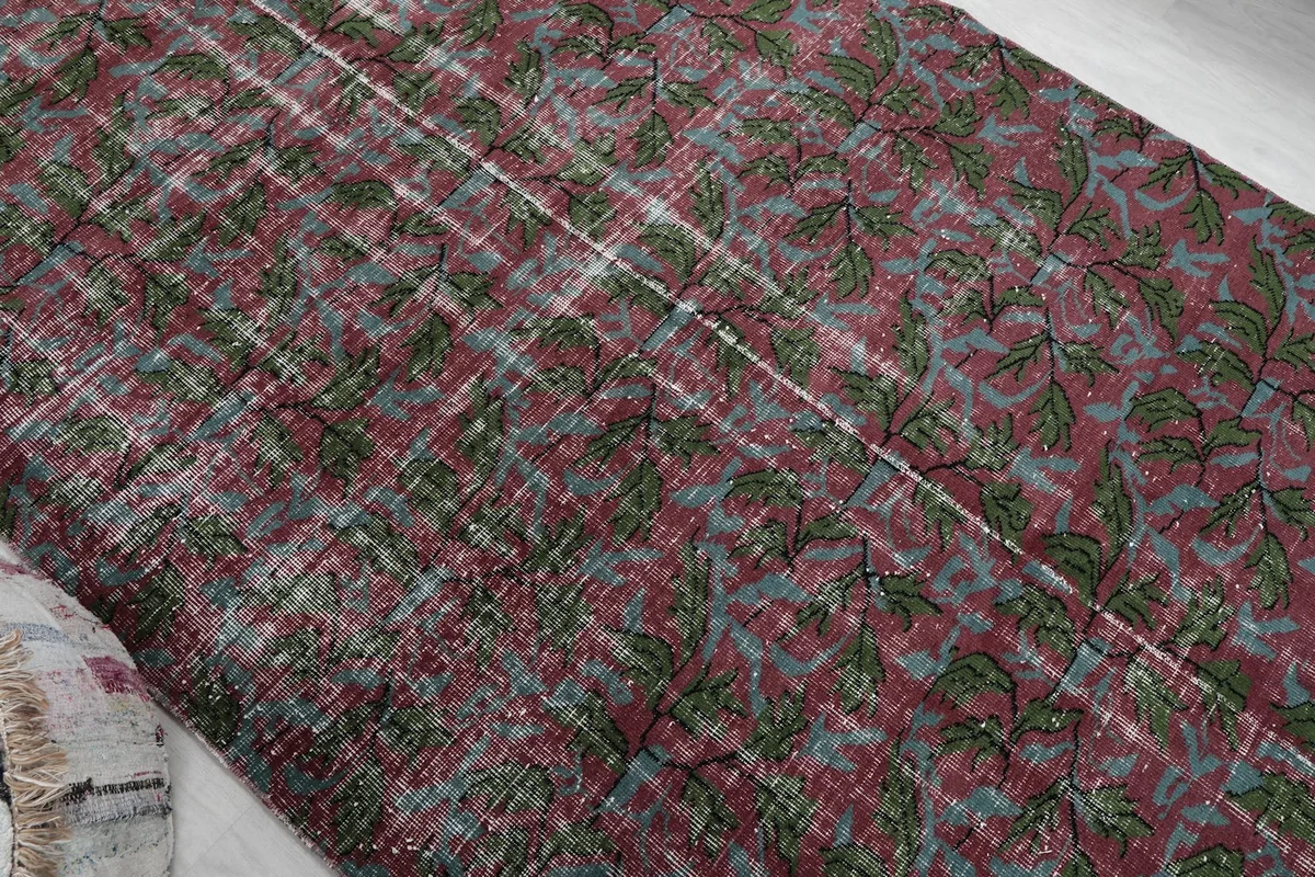 Overhead angle showcasing the full pattern and color variations across the vintage rug