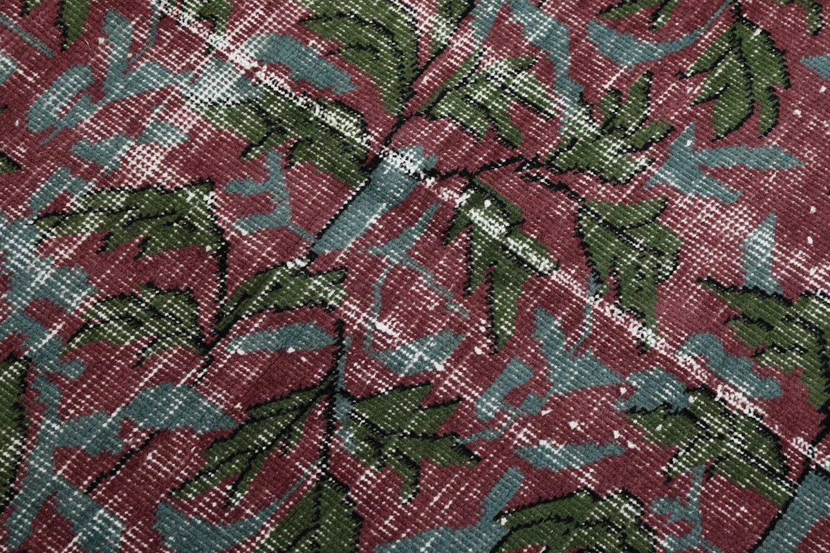 Close-up of the hand-knotted wool pile showing individual knots and color blending