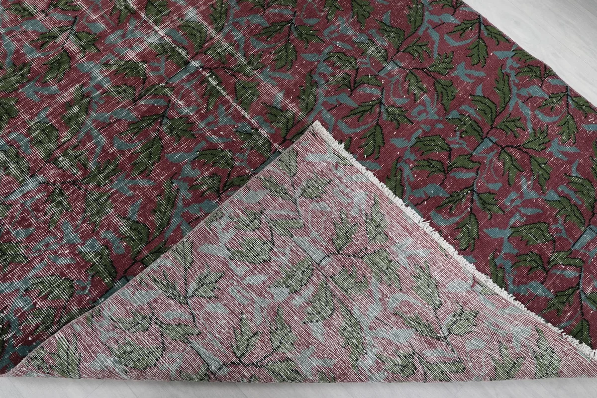 Underside of the rug, folded to show the cotton foundation and reverse of the knots