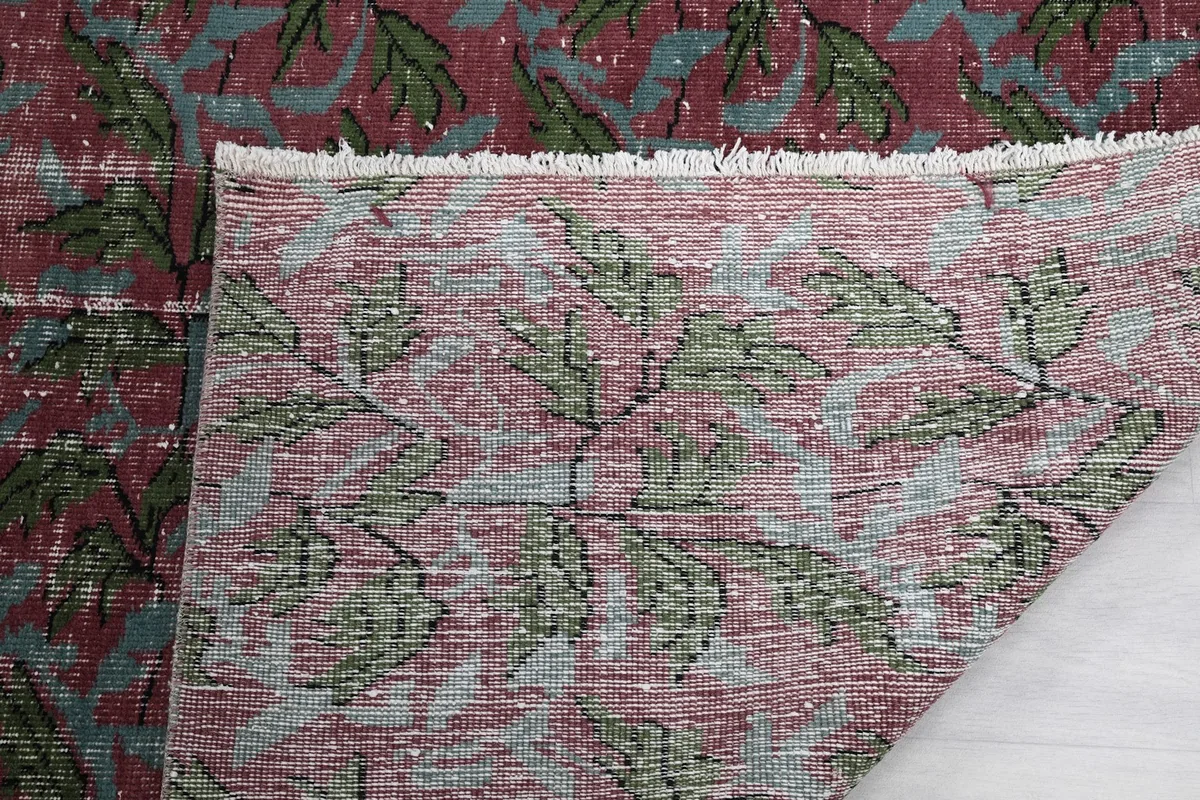 Detail of the rug's fringe and the back of the rug, revealing construction