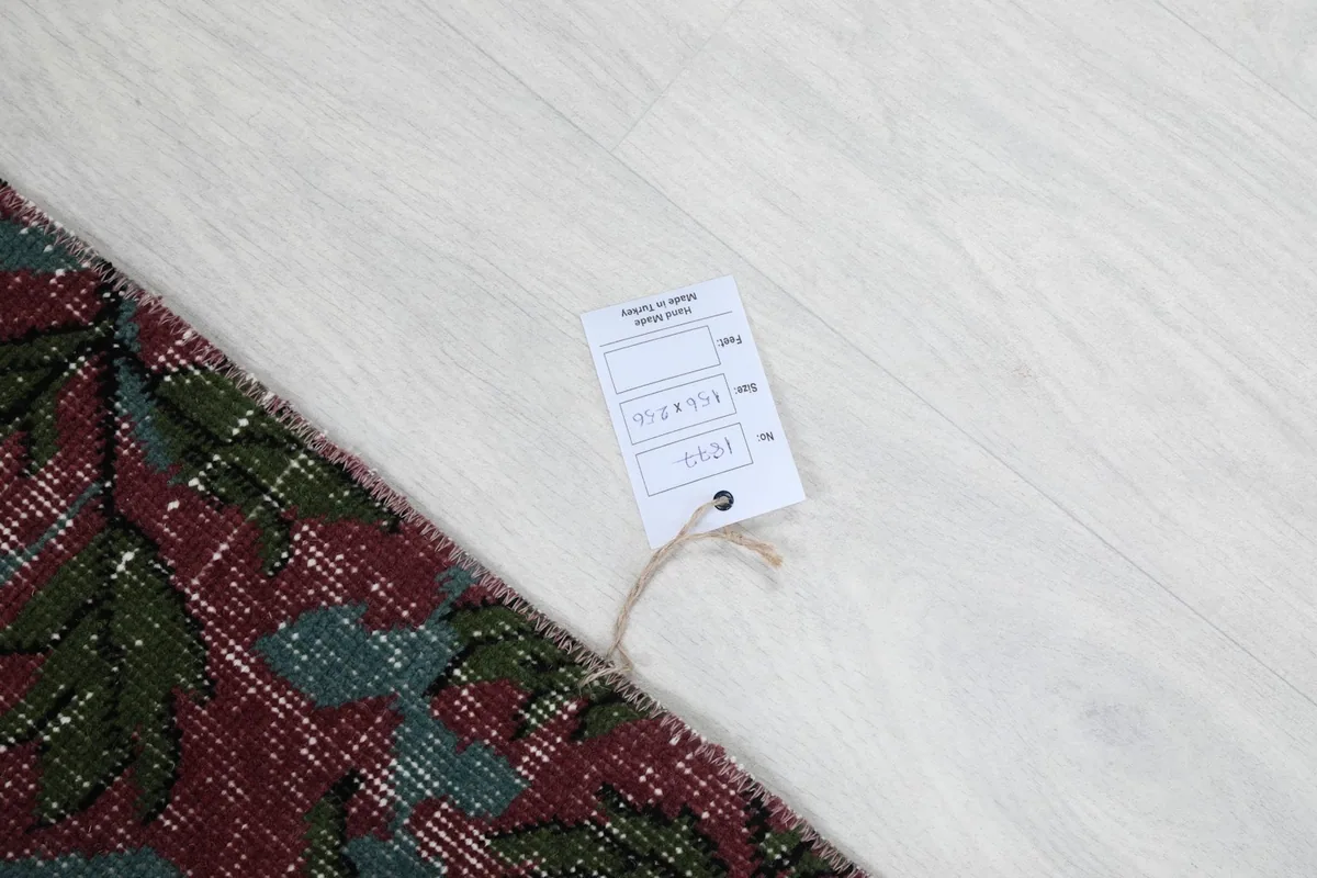 Corner of the rug with the product tag displaying size and item number