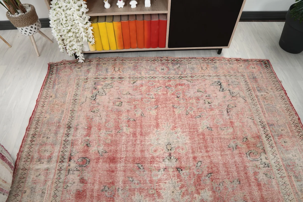 Top-down view showing the full length of the rug and its overall distressed appearance
