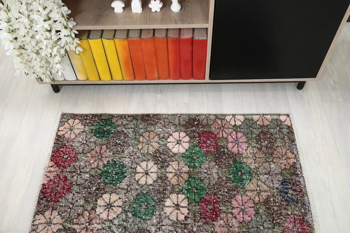 Overhead view of the multicolor rug in a room, highlighting its placement and scale