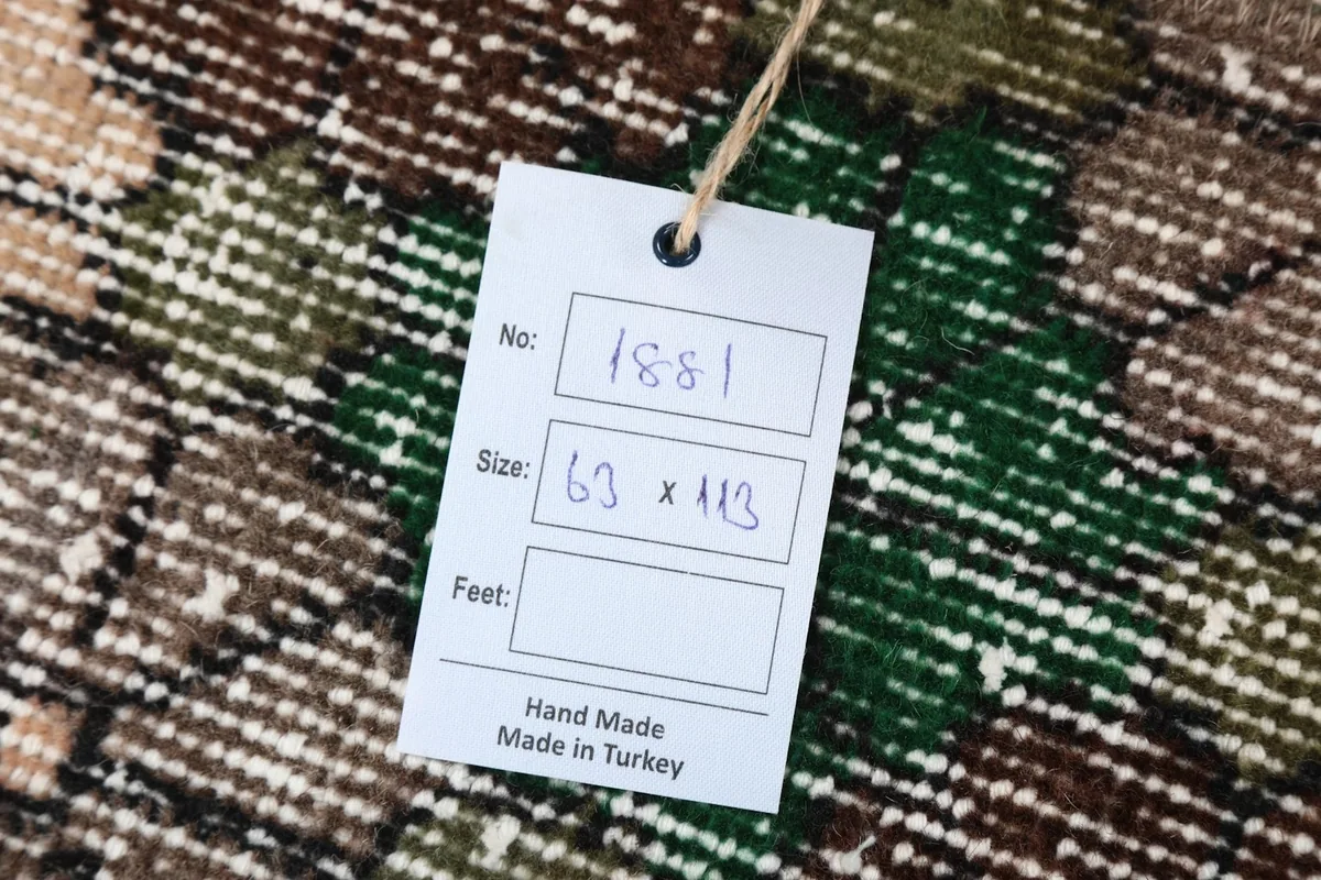 Close-up of the product tag indicating the rug's size and origin from Turkey