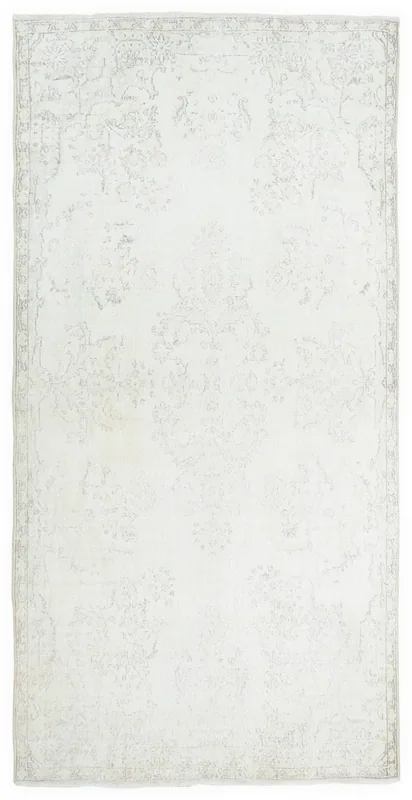 Full overhead view of the 5x9 cream and gray vintage Anatolian rug on a white background