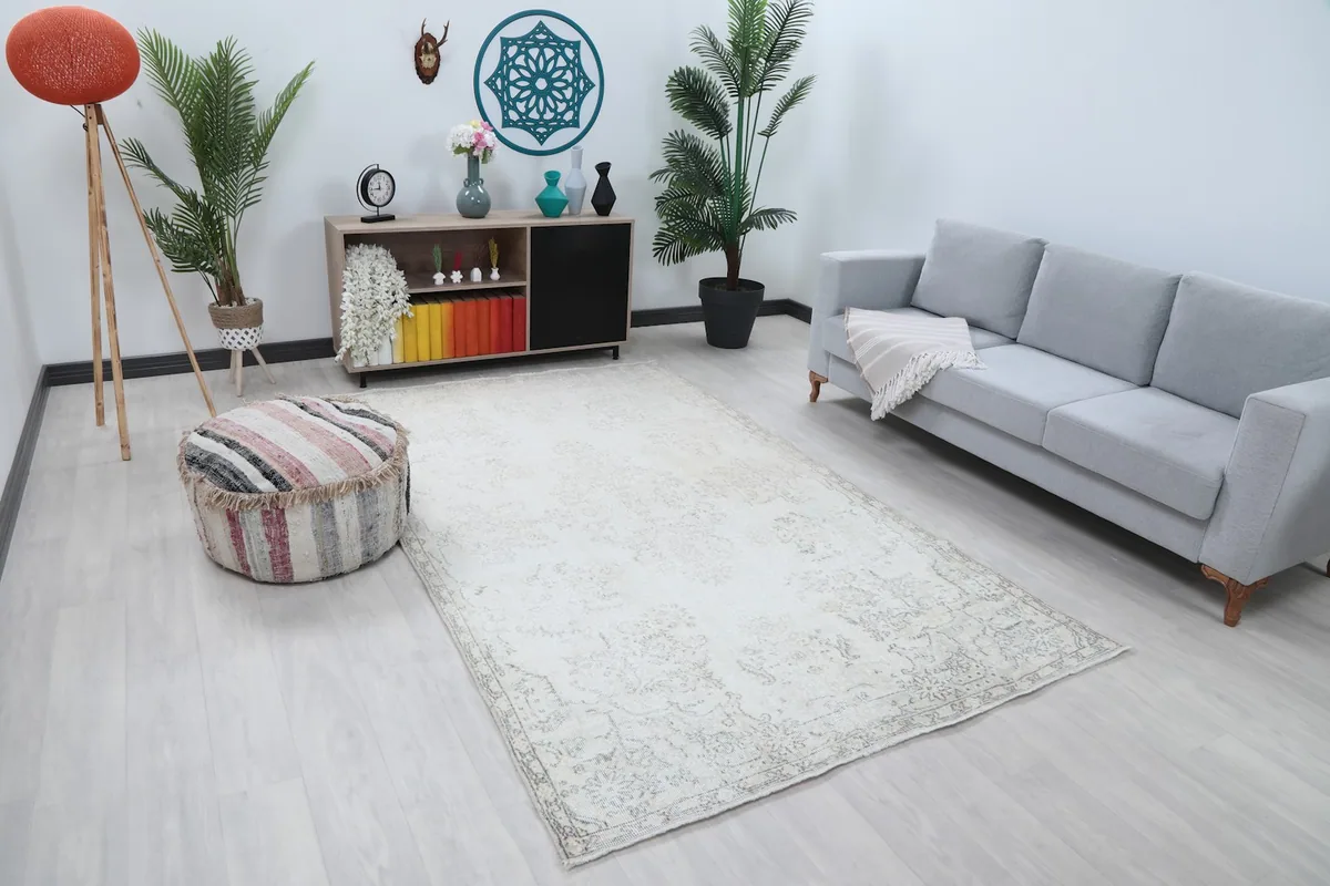 Overhead view of the vintage Anatolian rug in a room, showing its placement relative to furniture