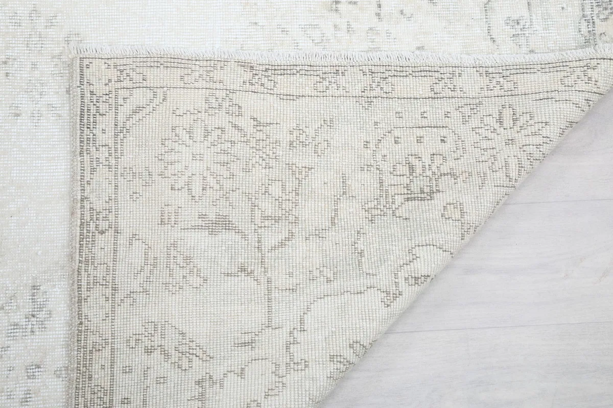 Close-up of the folded corner, showing the wool pile and cotton foundation construction