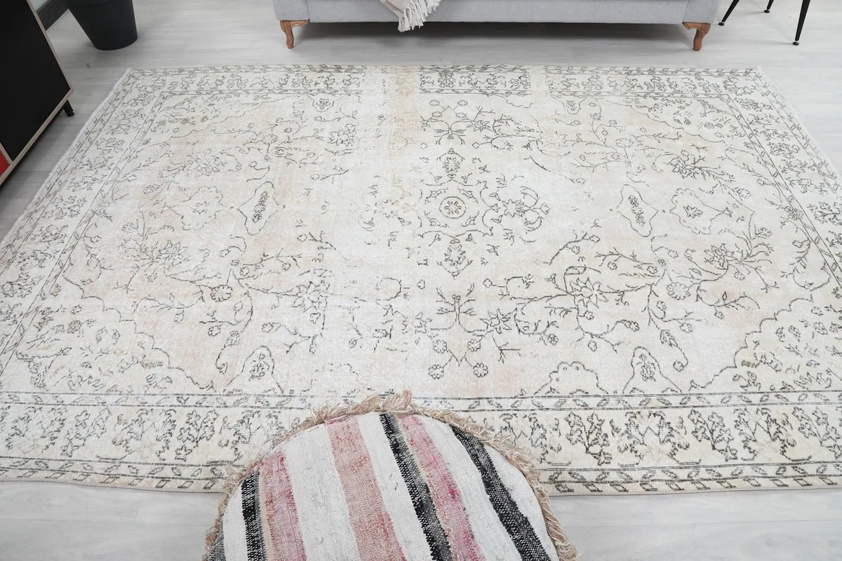 Full overhead view of the rug in a room, displaying its rectangular shape and large size.
