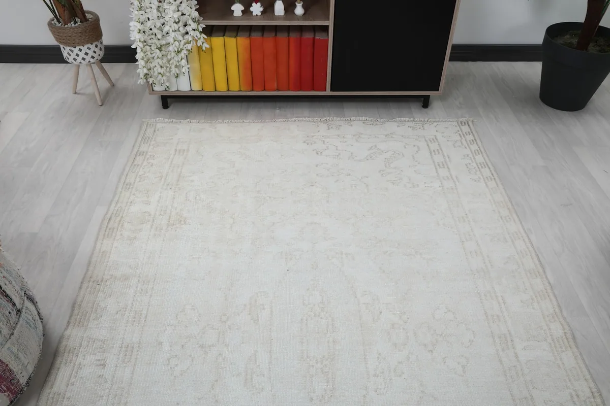 Overhead view of the ivory rug in the room, showing its full length from above