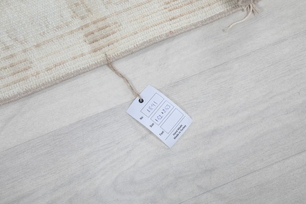 Close-up of the product tag attached to the rug, displaying item details
