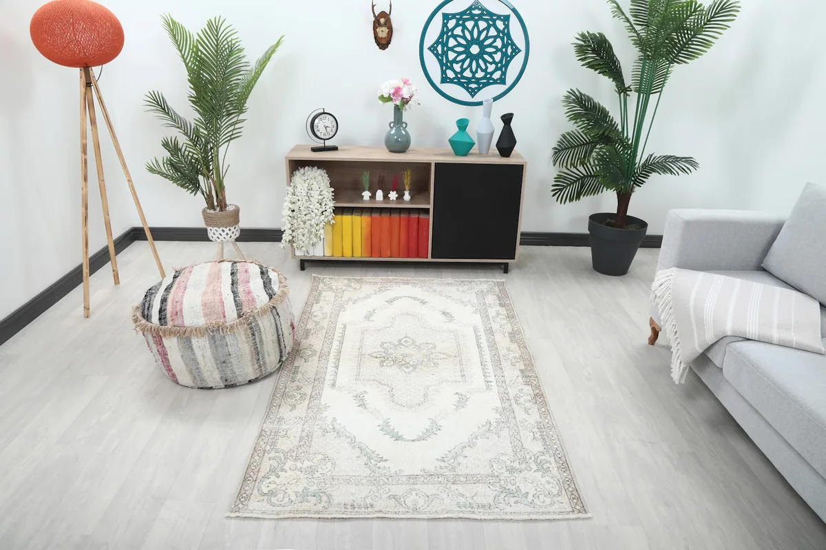 Ivory blue floral medallion rug in a modern living room setting