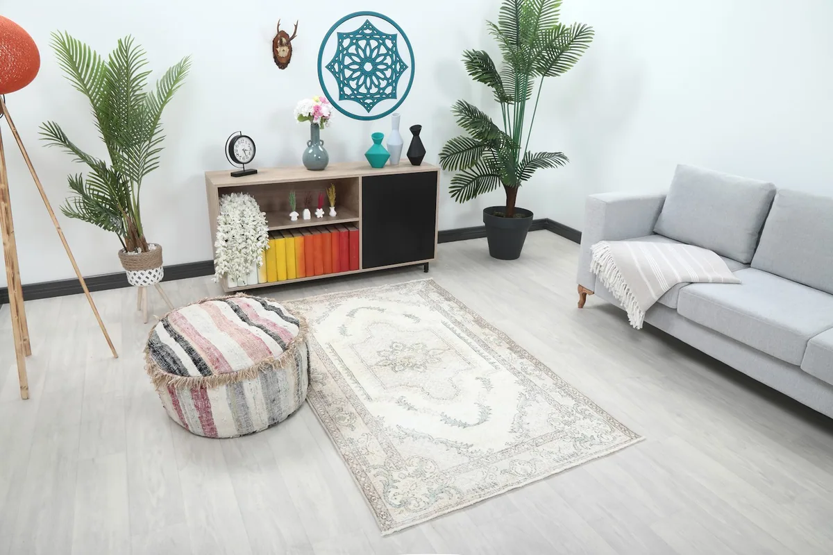 Full view of the ivory blue rug with light-colored furniture