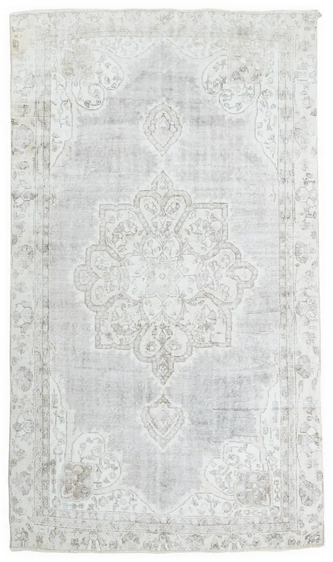 Full overhead view of the vintage gray and ivory Anatolian area rug with a central medallion
