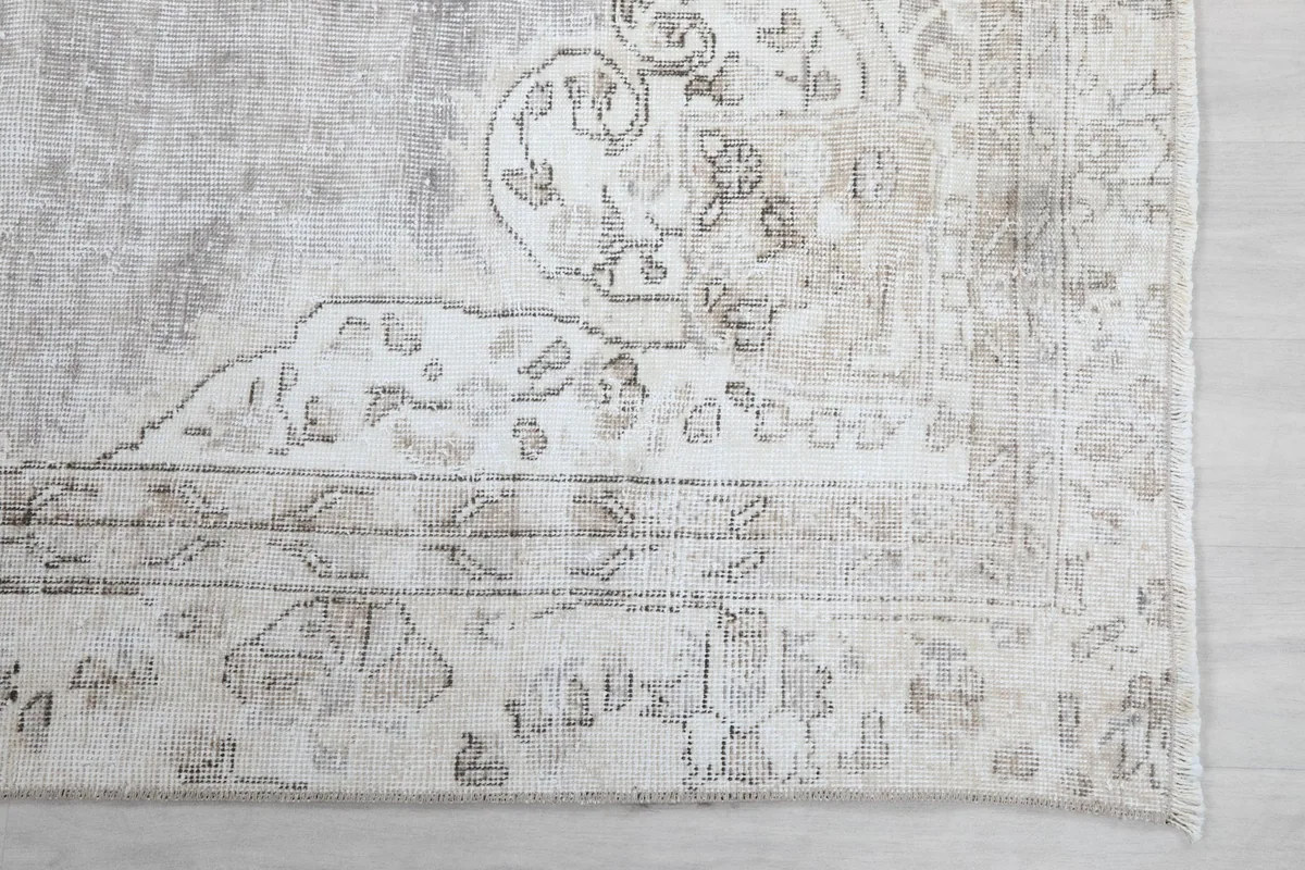 Close-up of the corner and border design of the vintage gray Anatolian rug