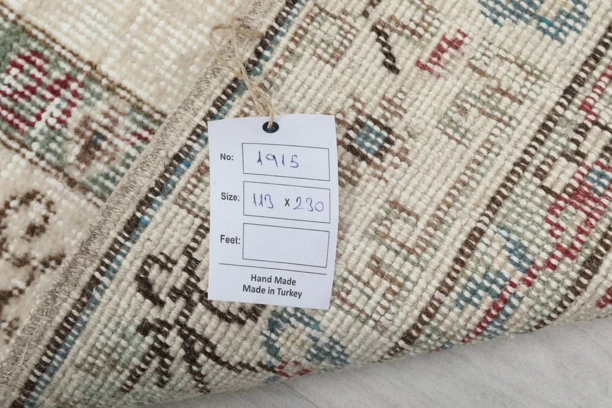 Back of the rug with a tag displaying product information including size and origin
