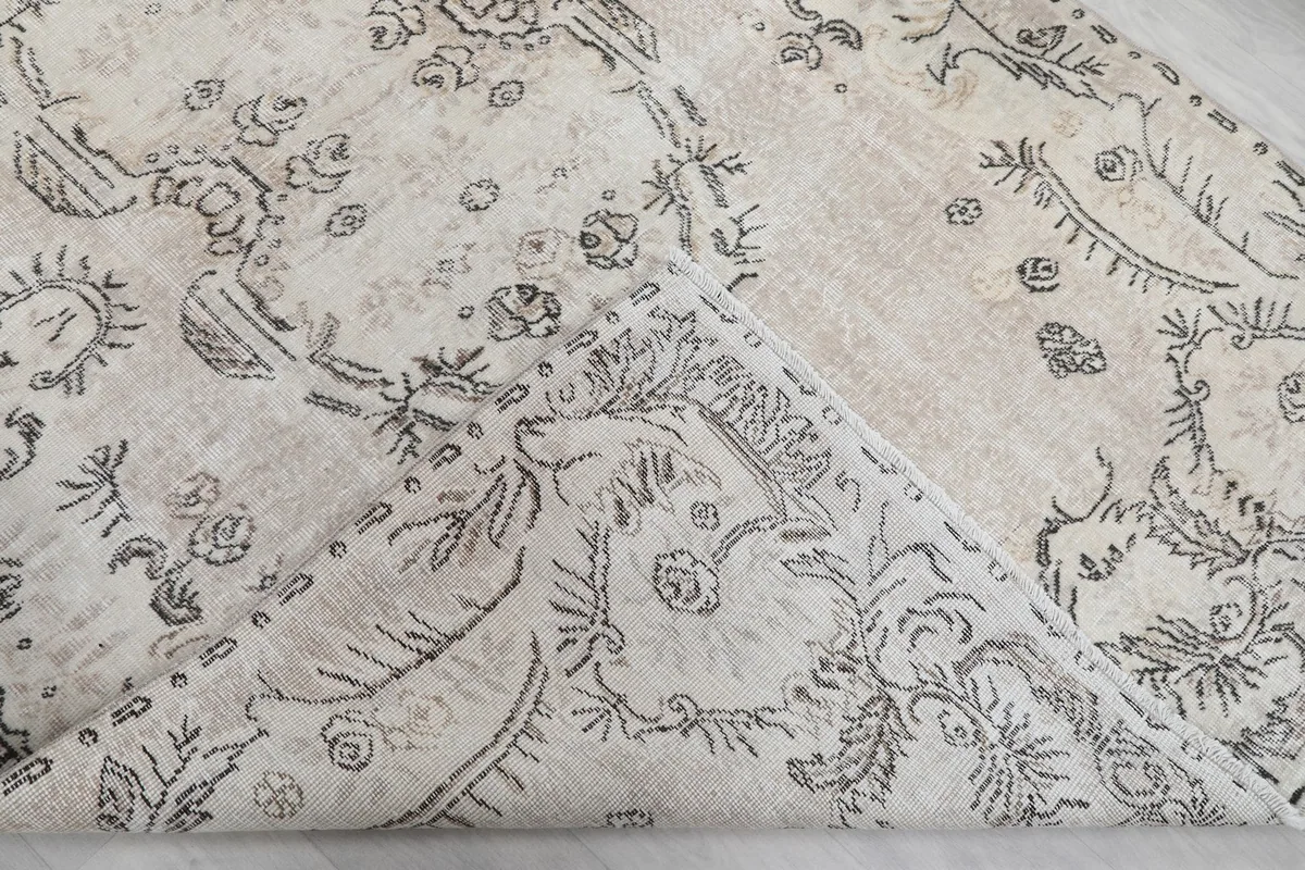 Folded section of the rug, revealing the thickness of the hand-knotted wool