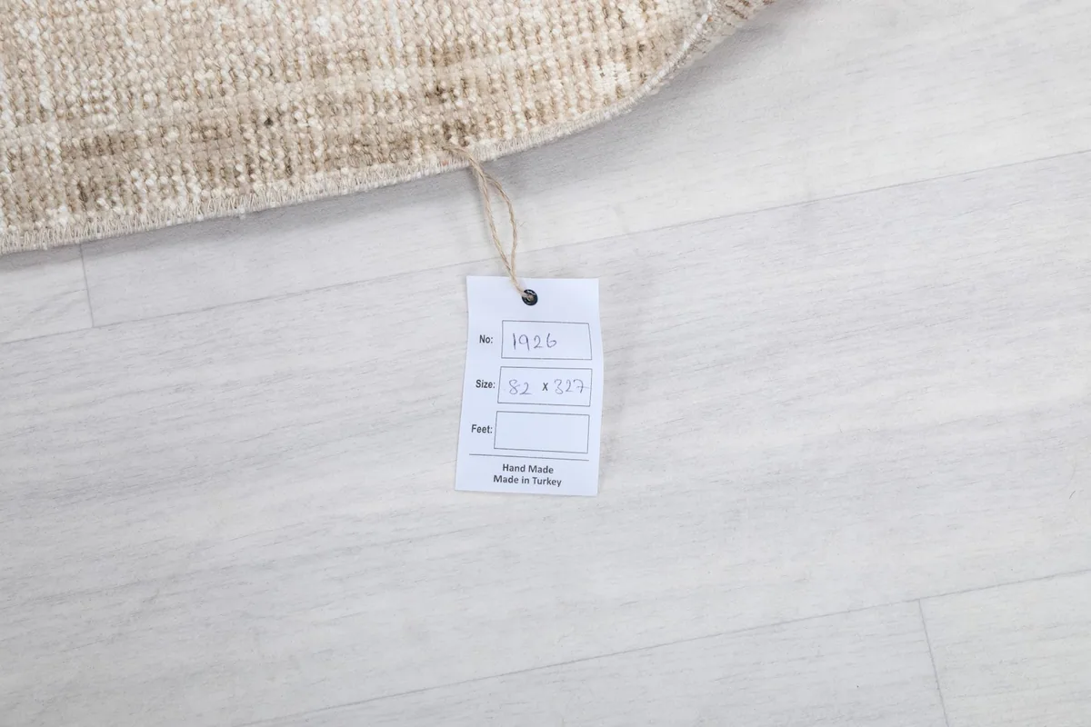 Product tag attached to the rug, showing size and origin information