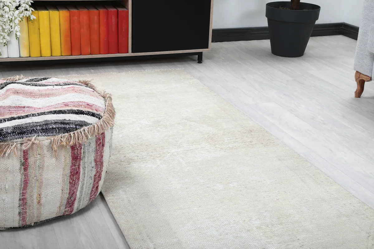 Close-up view of the runner's subtle beige and ivory colors and faded patterns