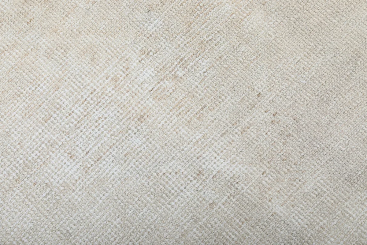 Texture of the low pile wool surface, highlighting the subtle color variations