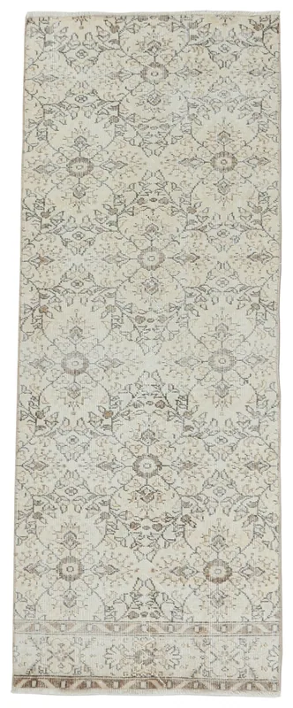 Full top view of the 2'9" x 7'2" ivory and tan vintage Anatolian runner rug on a white background.