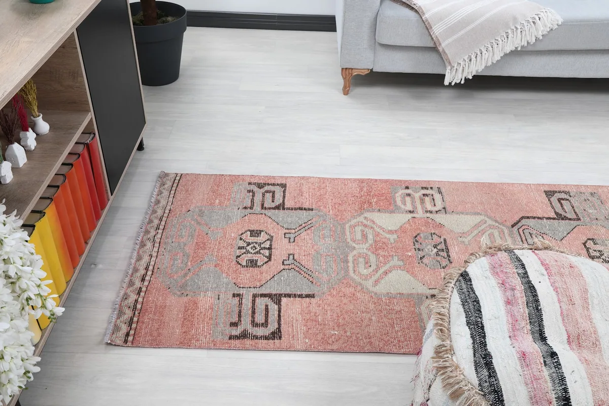 Room view showing the runner rug's placement in a hallway leading to a living area