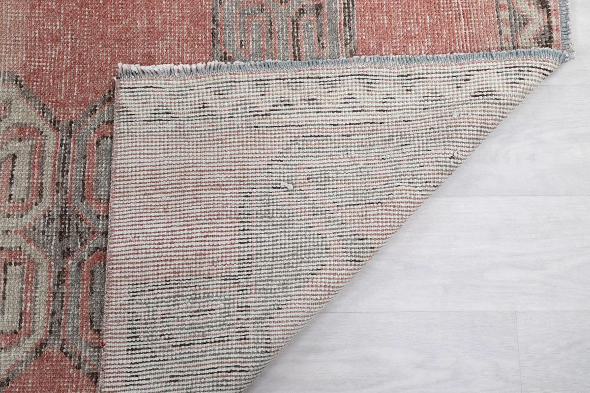 Detail of the rug's backing, showcasing the tight hand-knotted construction