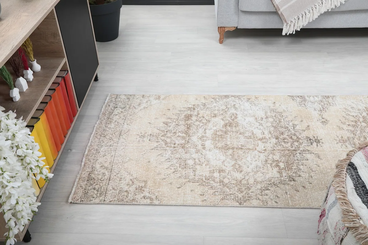 Angled room view of the runner rug, emphasizing its integration into the space and its soft color scheme.