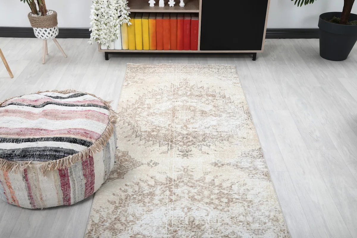 Overhead view of the runner rug in a room, highlighting its full length and subtle pattern.