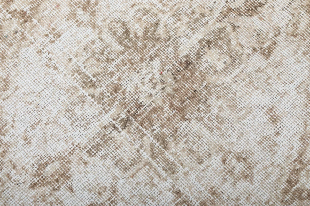 Overhead close-up showing the low wool pile and hand-knotted construction of the vintage runner.