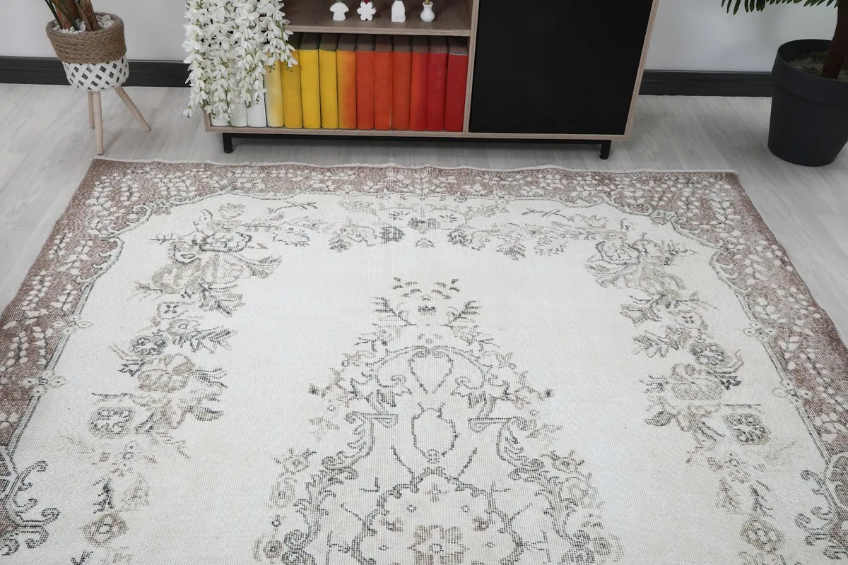 Overhead angle showing the rug's top portion, including the border and medallion