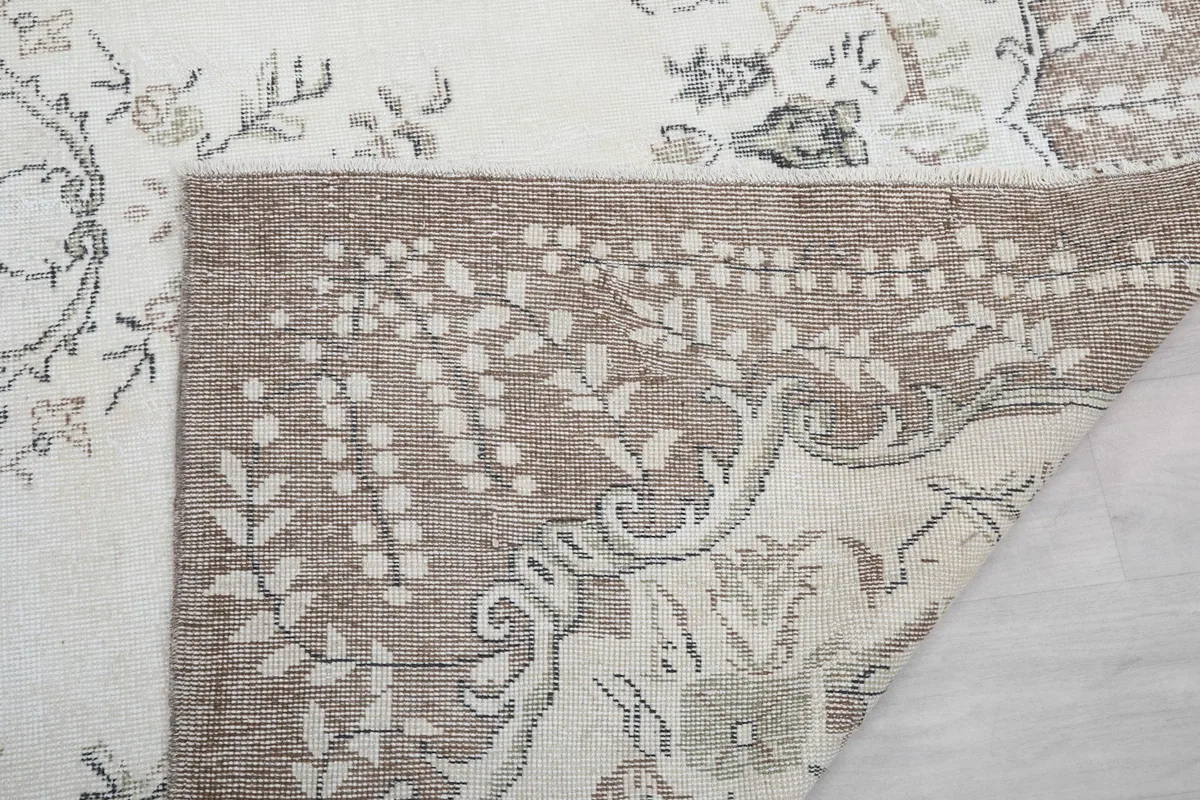 Another view of the folded corner, showing the rug's construction and condition