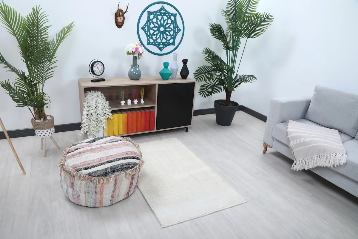 Overhead view of the ivory rug in a room setting, showing its placement relative to furniture.