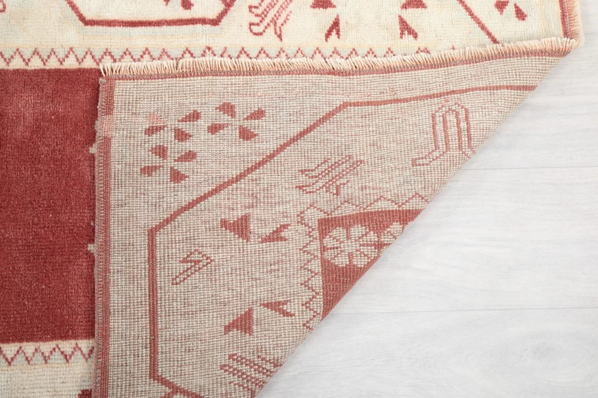 Another view of the reverse side of the hand-knotted rug, showing its construction