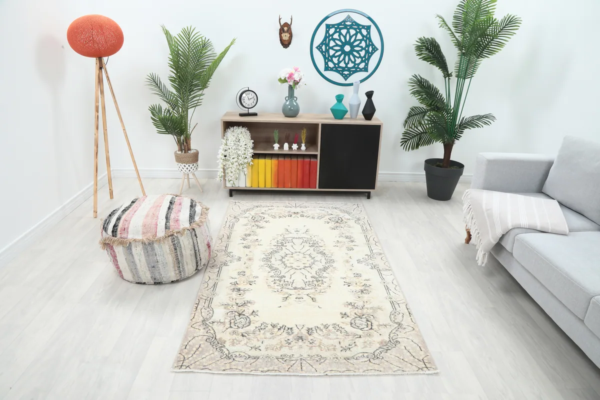 Cream Floral Medallion Anatolian Rug in a living room setting, angled view