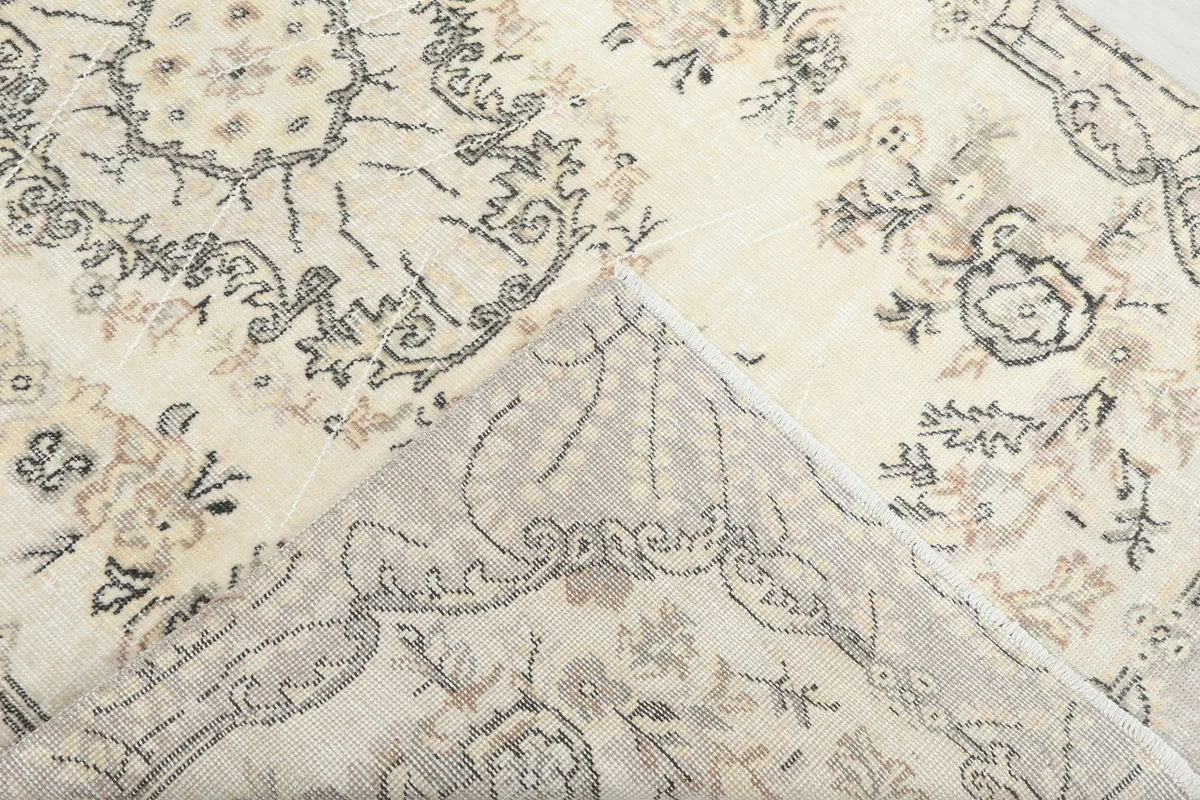 View of the Cream Floral Medallion Anatolian Rug's back, revealing the hand-knotted cotton foundation