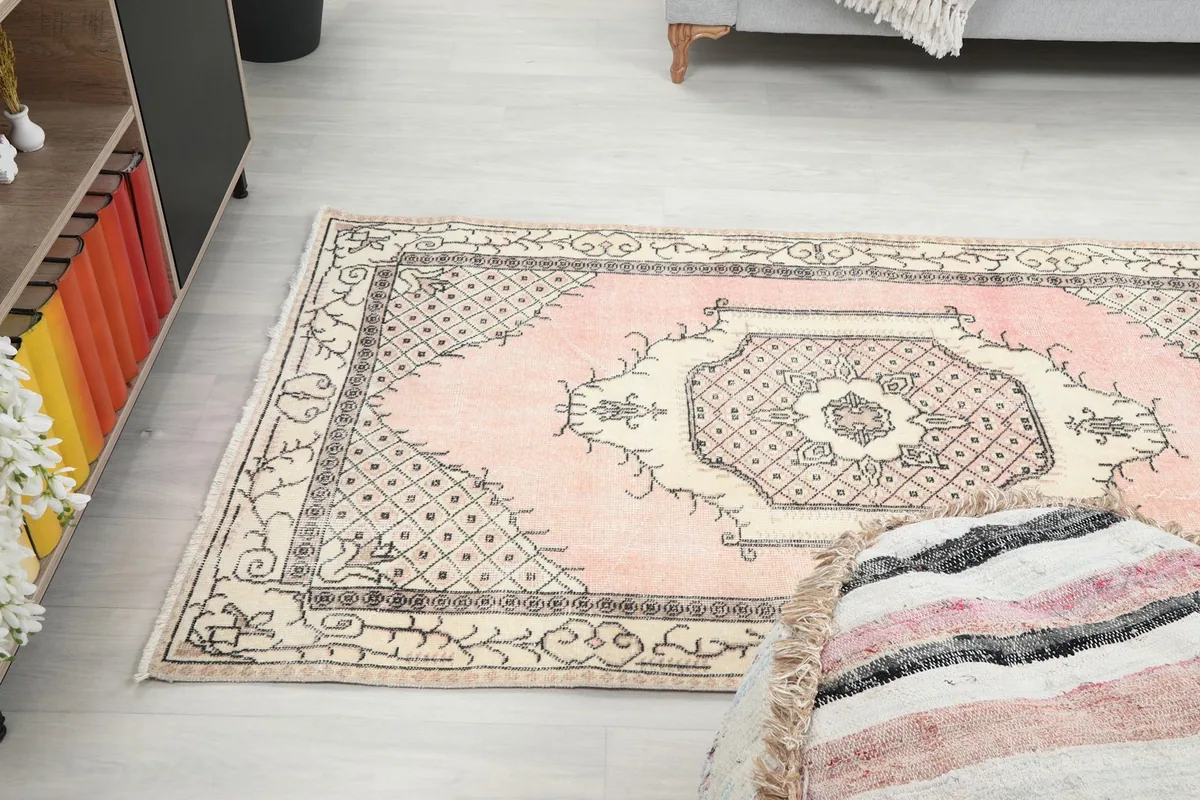 Angle view of the full rug on the floor, showing its placement relative to furniture
