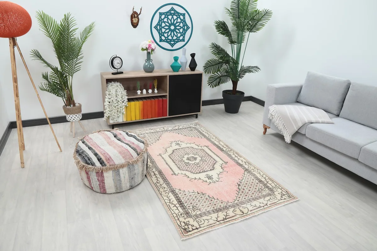 Angle view of the pink and ivory Anatolian rug complementing the decor in a contemporary room
