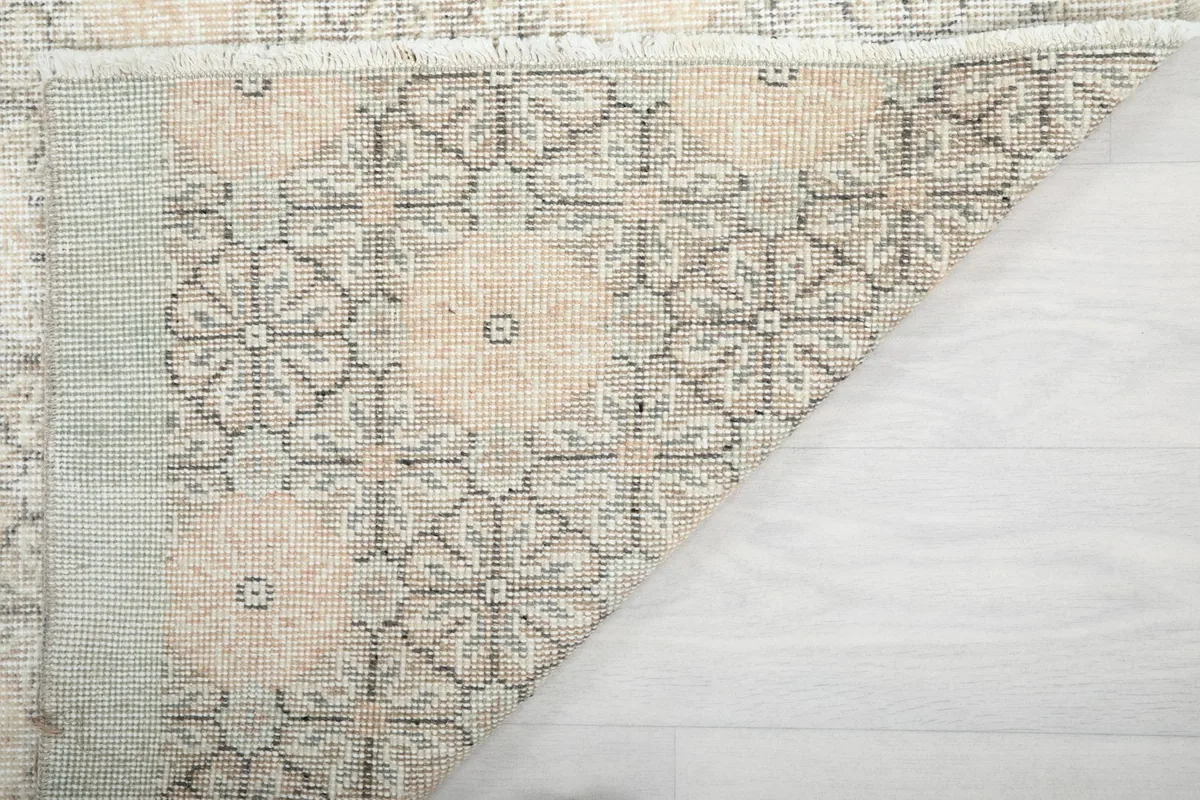 Close-up of the back of the rug, revealing the intricate knotting and craftsmanship.