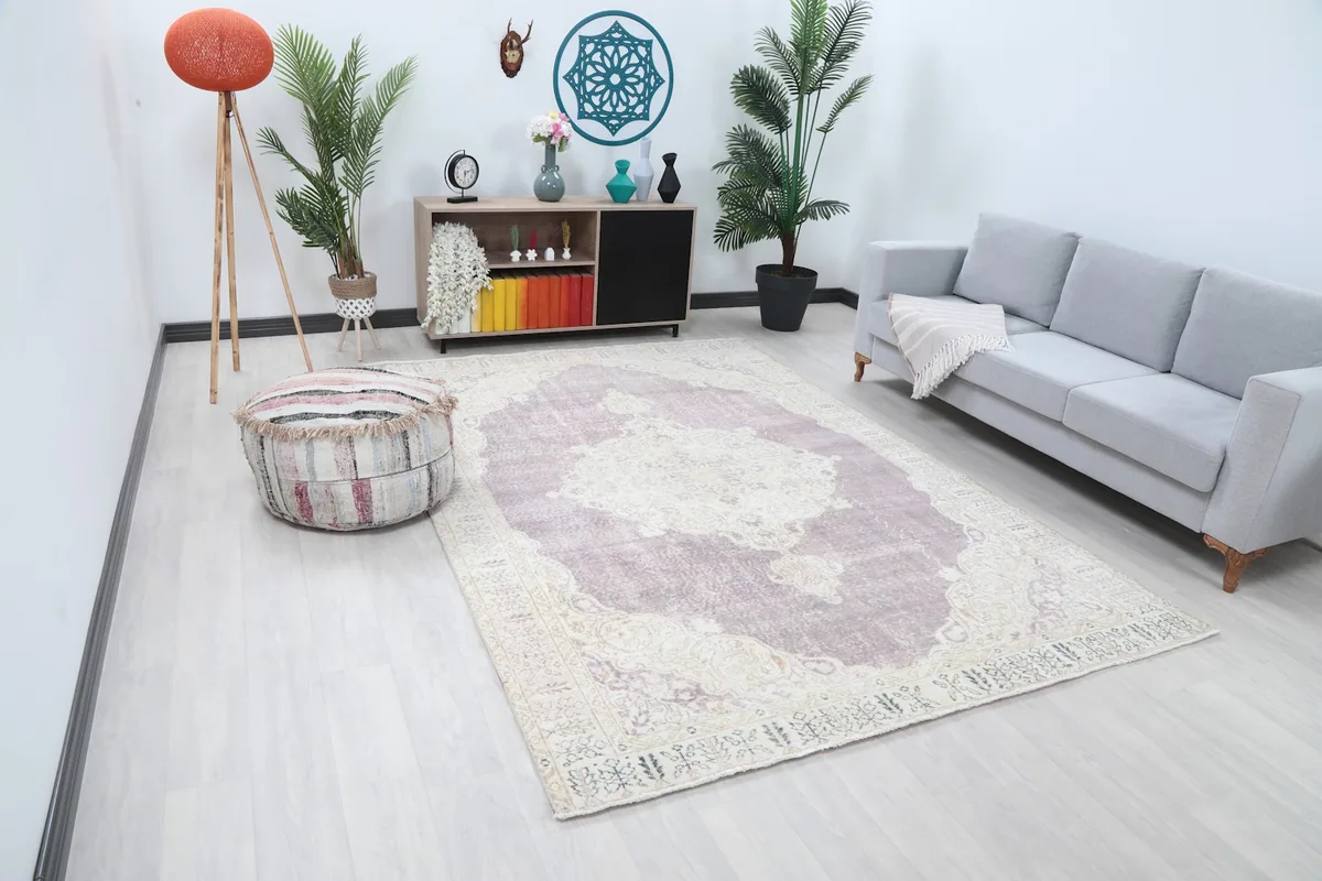 Angle view of the Anatolian rug in a living space, showing its placement under a sofa