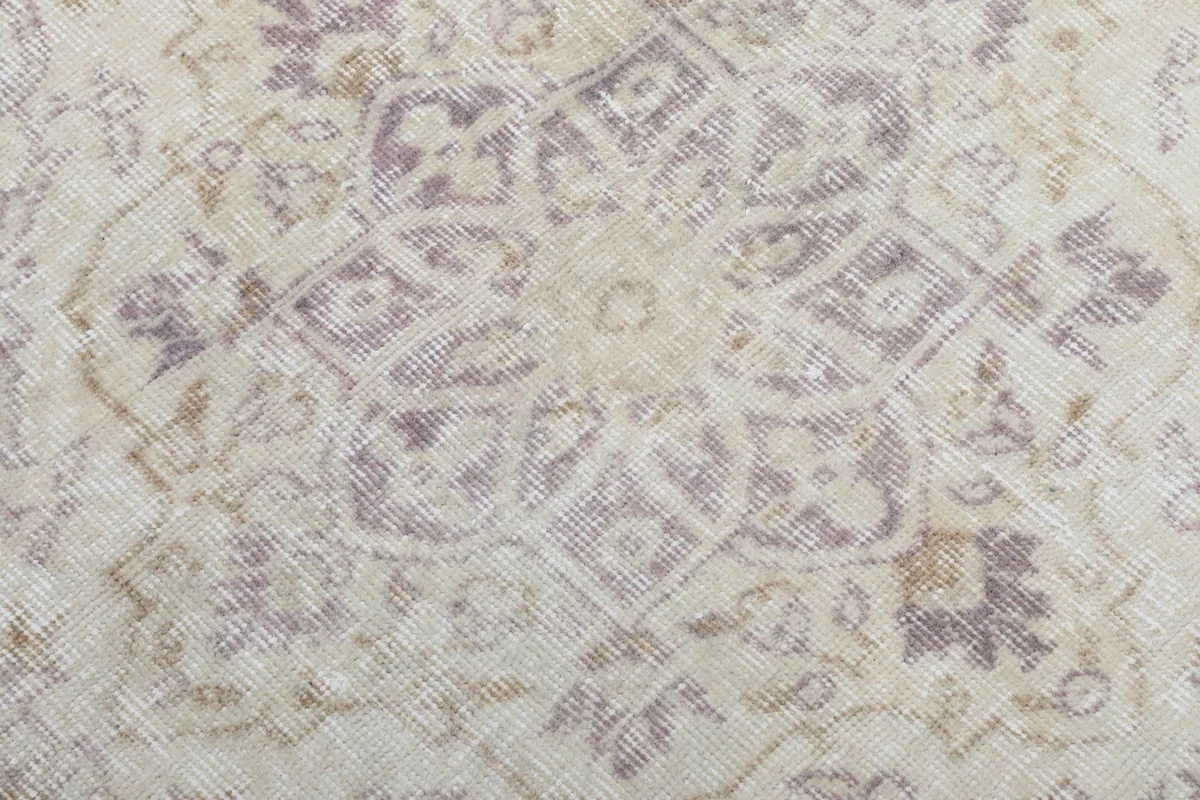 Extreme close-up of the wool pile and intricate patterns within the medallion